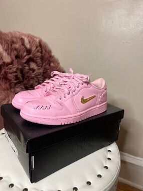 Nike Women’s  Pink Low-Top Sneakers with Gold Swoosh Accent